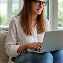 Person using a laptop for online learning